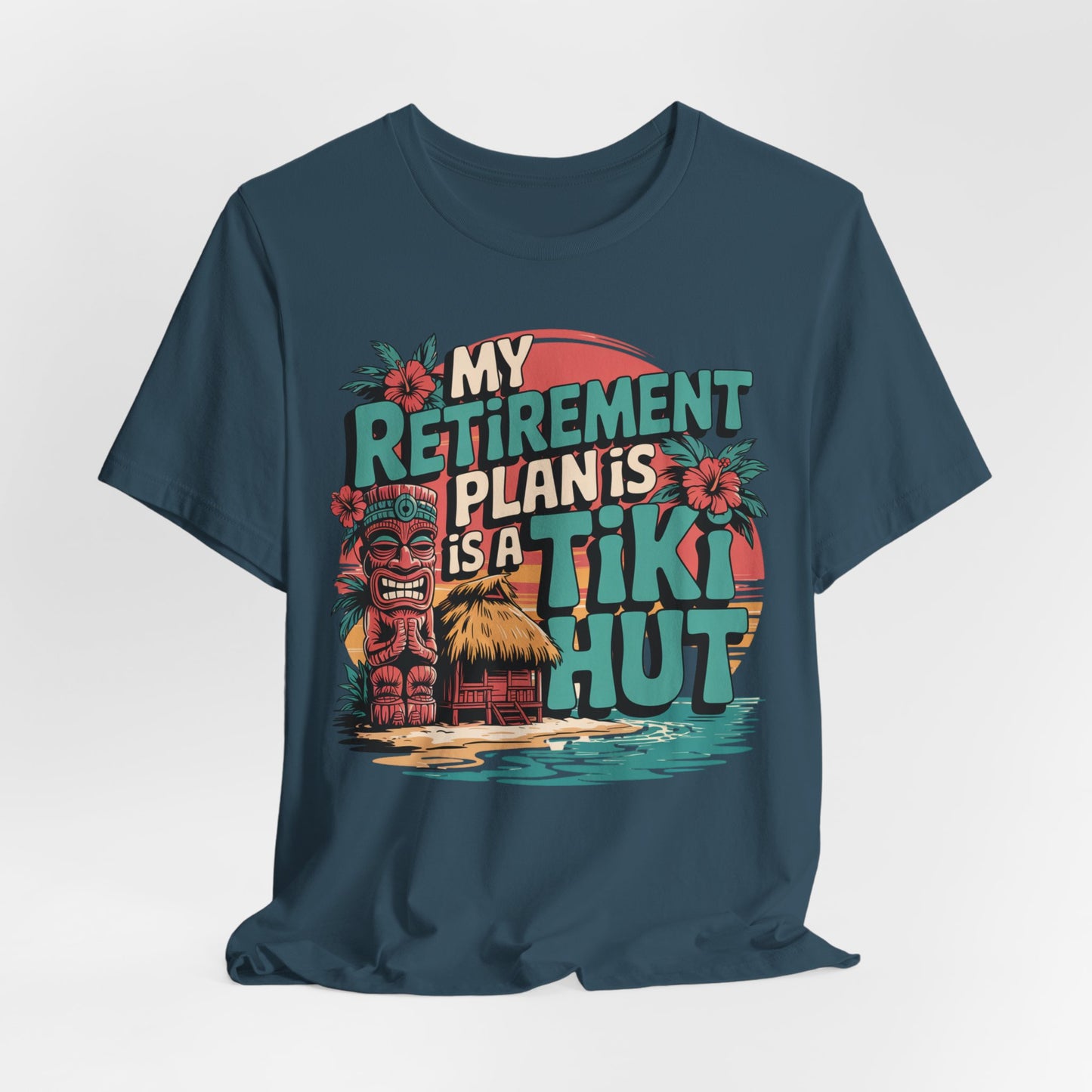 The Tiki Hut Retirement Plan Tiki T-Shirt is a blue unisex tee showing a tiki statue, tropical flowers, a hut, water, and sunset with My retirement plan is a tiki hut—a fun and perfect gift for beach lovers.