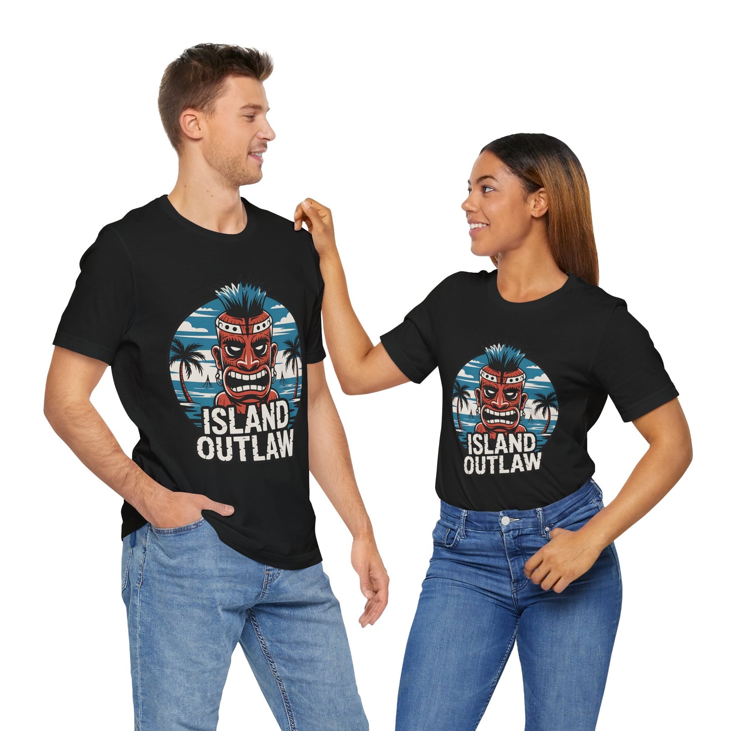 A man and woman smile at each other in matching Island Outlaw Tiki T-Shirt – Unisex Jersey Tees for Tropical Vibes, featuring a tiki mask and palm trees design, perfect for vacation, against a white background.
