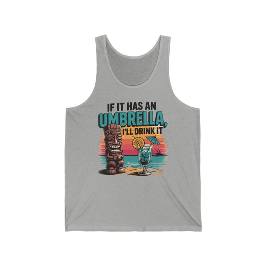 The Tropical Vibe Unisex Jersey Tiki Tank Top features a gray base with a tiki statue, cocktail, sunset, and “If It Has An Umbrella, Ill Drink It” text—a fun summer top perfect for any vacation or tropical getaway.