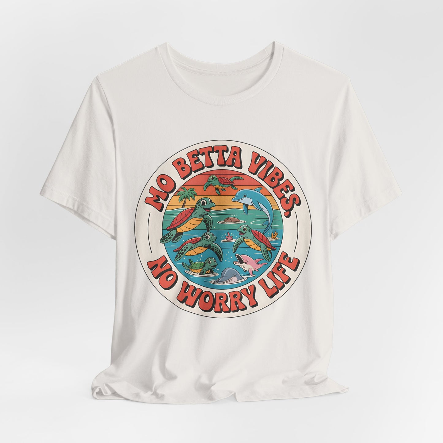 The Mo Betta Vibes Unisex Jersey T-Shirt features a relaxed fit and a vibrant circular design with sea turtles, dolphins, waves, and bold red MO BETTA VIBES, NO WORRY LIFE text—perfect for uplifting your summer casual style.