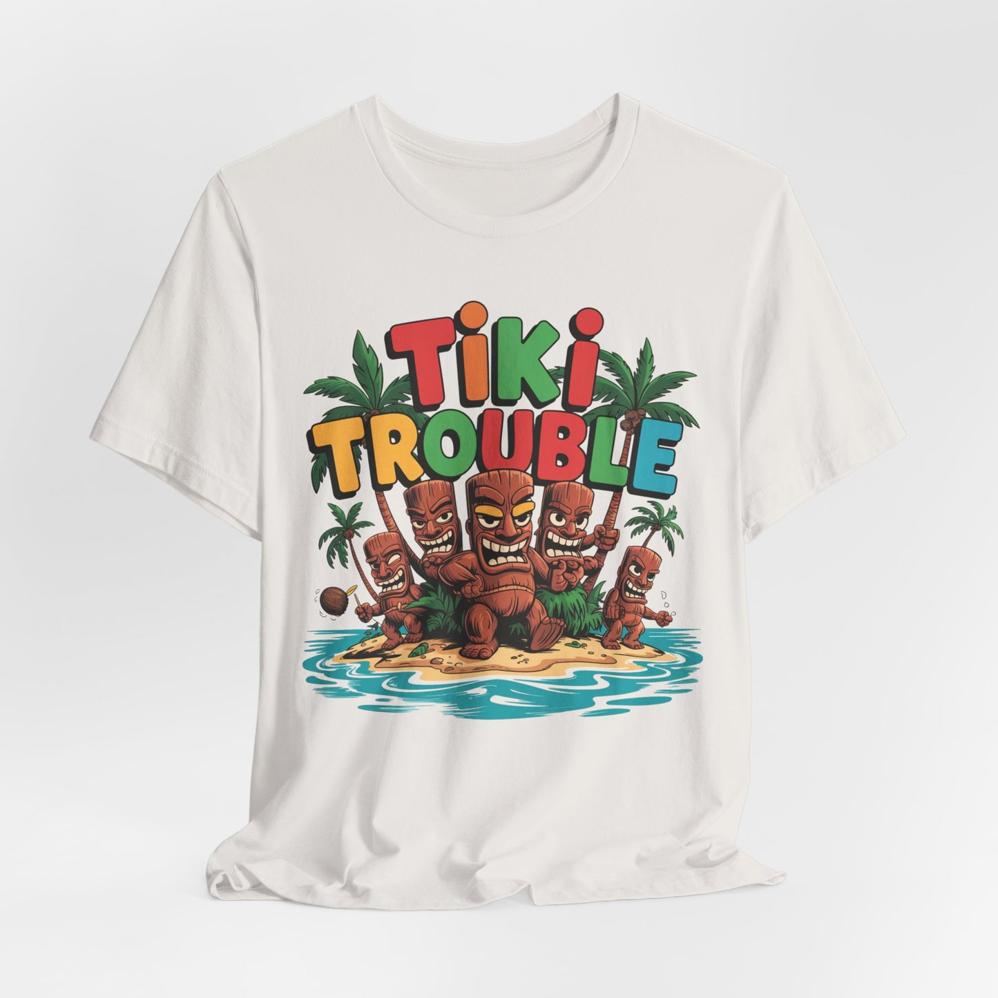 The Tiki Trouble Unisex Tiki T-Shirt features a vibrant cartoon of island tikis, palm trees, and water with “Tiki Trouble” in bold multicolored letters—perfect for fun summer celebrations and tropical vibes.