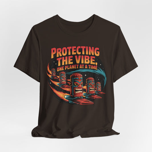 The Protecting the Vibe Unisex Tiki T-Shirt is an eco-friendly black tee featuring colorful tiki faces, surfboards, and “Protecting the Vibe, One Planet at a Time” in retro lettering—perfect for those with cosmic style and eco-conscious values.