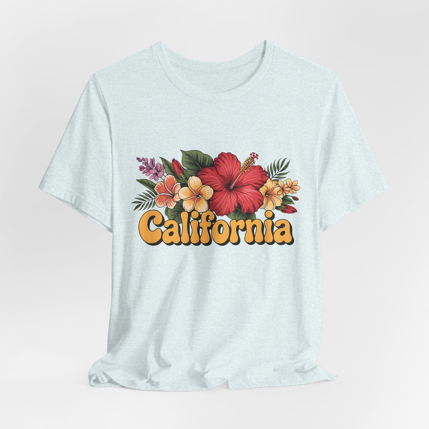 The California Floral Graphic T-Shirt features a vibrant floral graphic with tropical flowers above bold yellow California text, offering summer vibes in a light-colored unisex jersey short sleeve design.