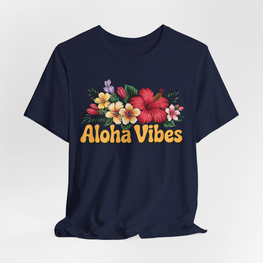 The Aloha Vibes Floral Unisex T-Shirt for Island Vibes is a navy tee with vibrant hibiscus and plumeria prints above bold yellow Aloha Vibes text, made from breathable fabric for all-day comfort.