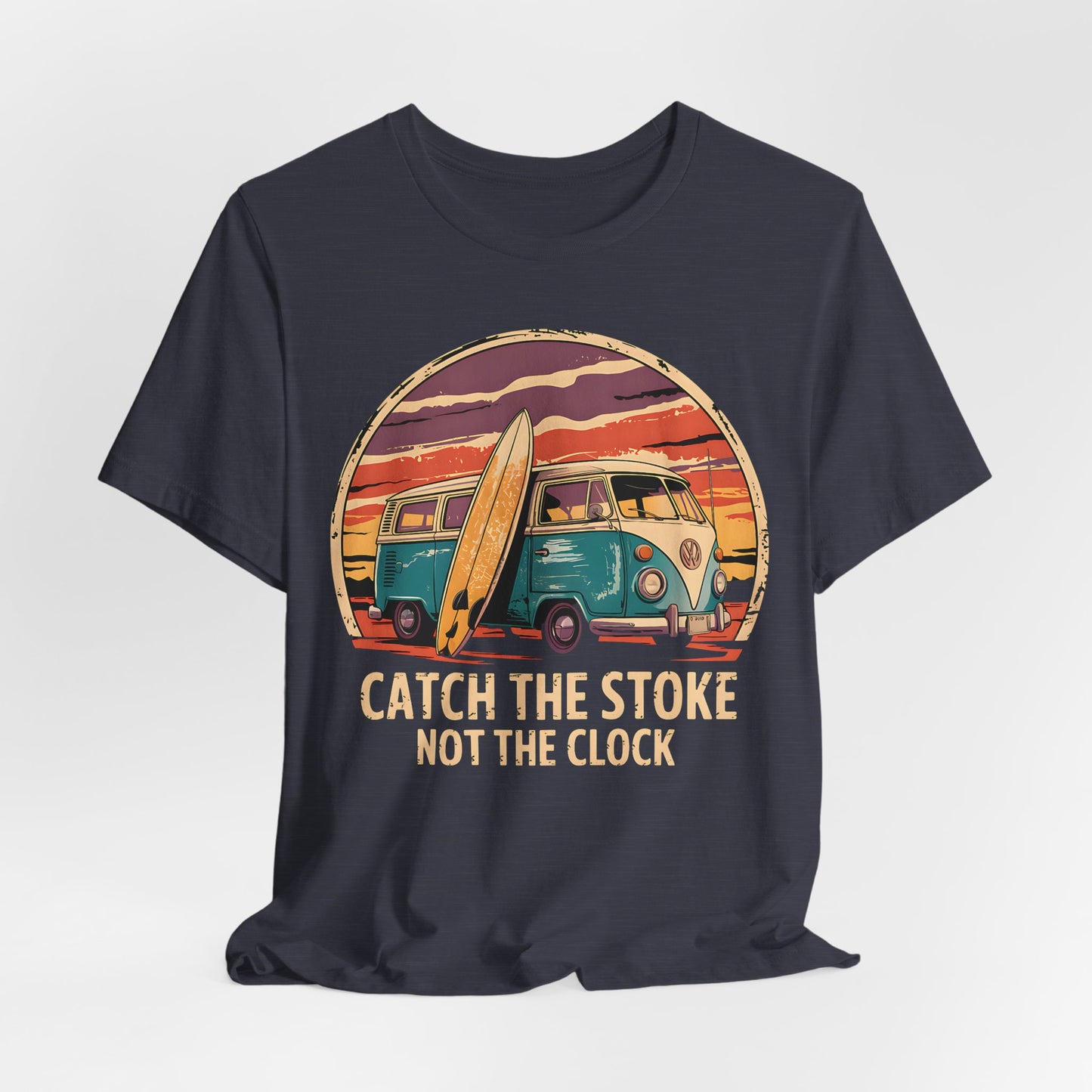 The Catch the Stoke Surf Tee is a black unisex jersey short sleeve shirt featuring a vintage teal van and surfboard at sunset, capturing classic surf culture. Made from breathable cotton. Text: CATCH THE STOKE NOT THE CLOCK.