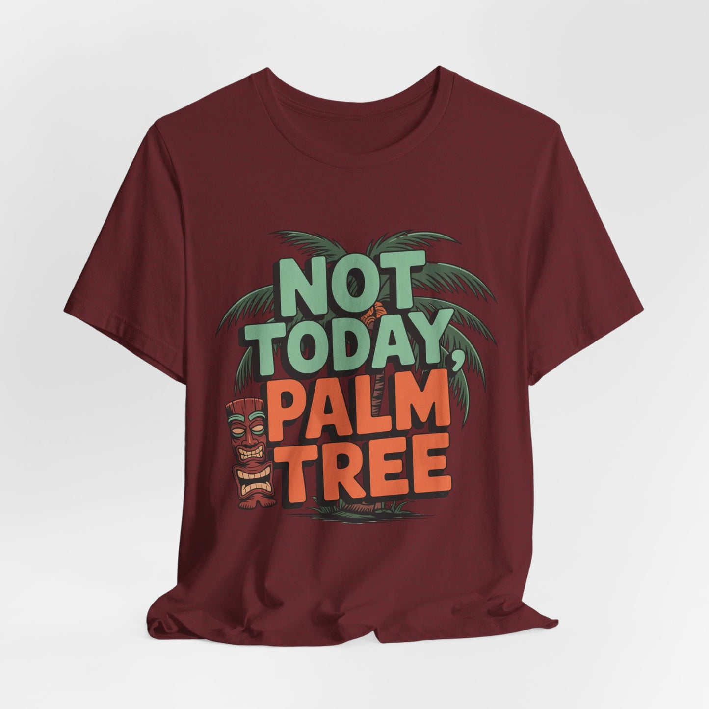 The Tropical Vibes Unisex Tiki T-Shirt - Not Today, Palm Tree is a maroon tee with a palm tree and tiki mask graphic plus bold green and orange text—ideal for laid-back summer gatherings.
