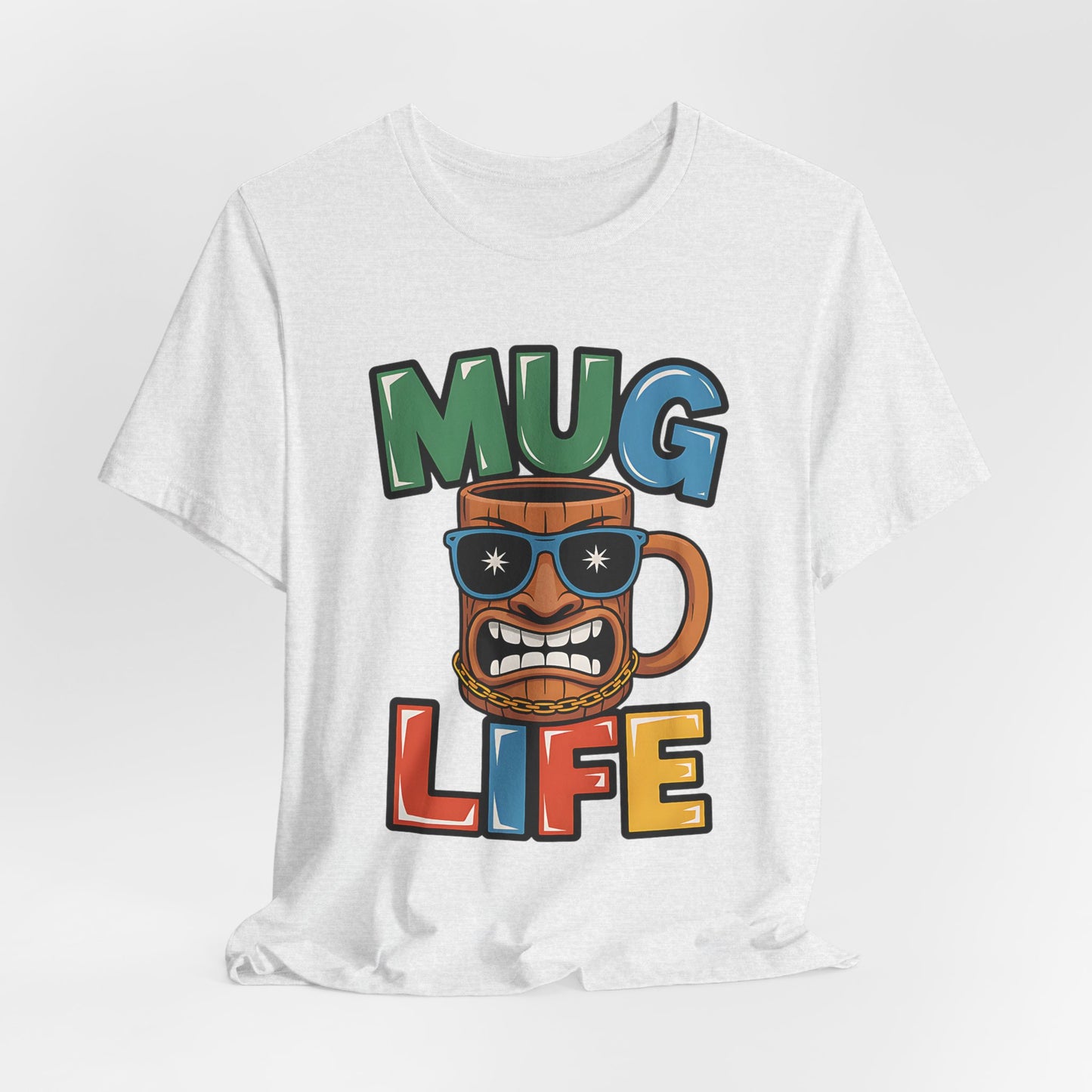 Perfect for coffee fans, the Mug Life Graphic Tiki T-Shirt is a fun unisex jersey featuring a cartoon mug with sunglasses, gold chain, and Mug Life lettering in a bold, playful design.