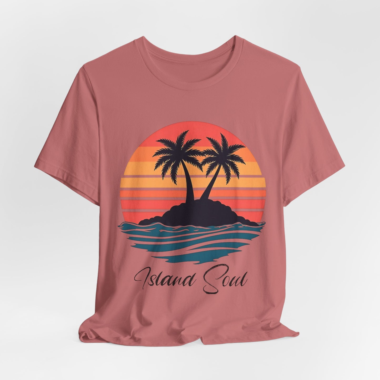 The Island Soul Unisex T-Shirt features a pink retro sunset design with two palm trees on an island and Island Soul text below—perfect for adding laid-back beach vibes to your collection.
