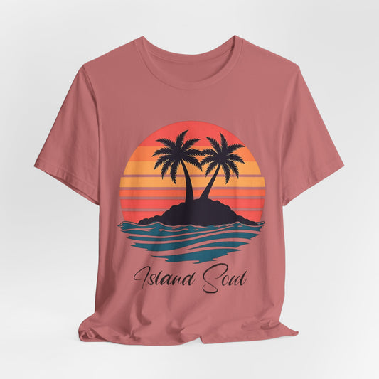 The Island Soul Unisex T-Shirt features a pink retro sunset design with two palm trees on an island and Island Soul text below—perfect for adding laid-back beach vibes to your collection.