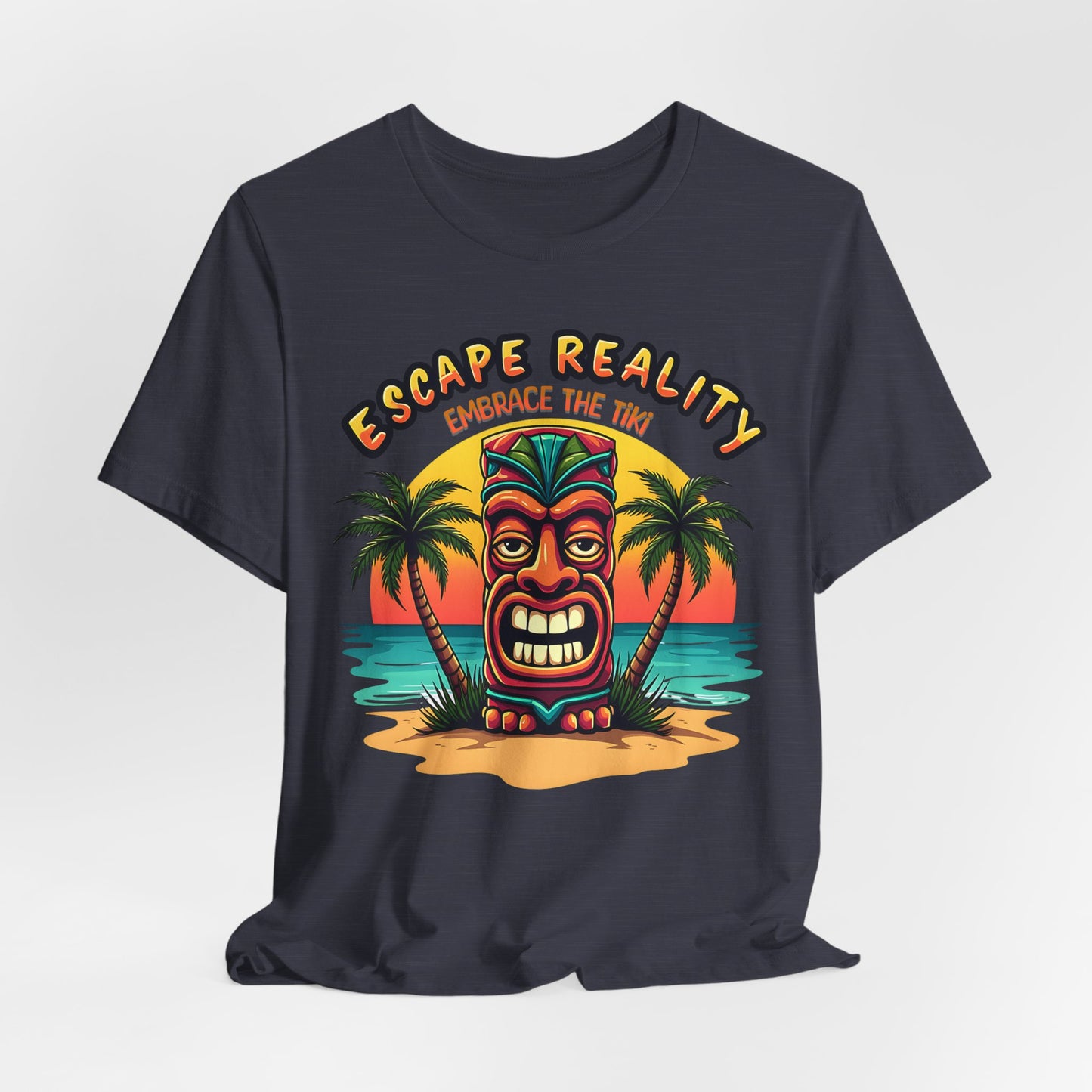 The Escape Reality Unisex Tiki T-Shirt features a colorful tiki statue on a sandy island at sunset with palm trees and the text ESCAPE REALITY above and EMBRACE THE TIKI below—perfect for summer or beach getaways.
