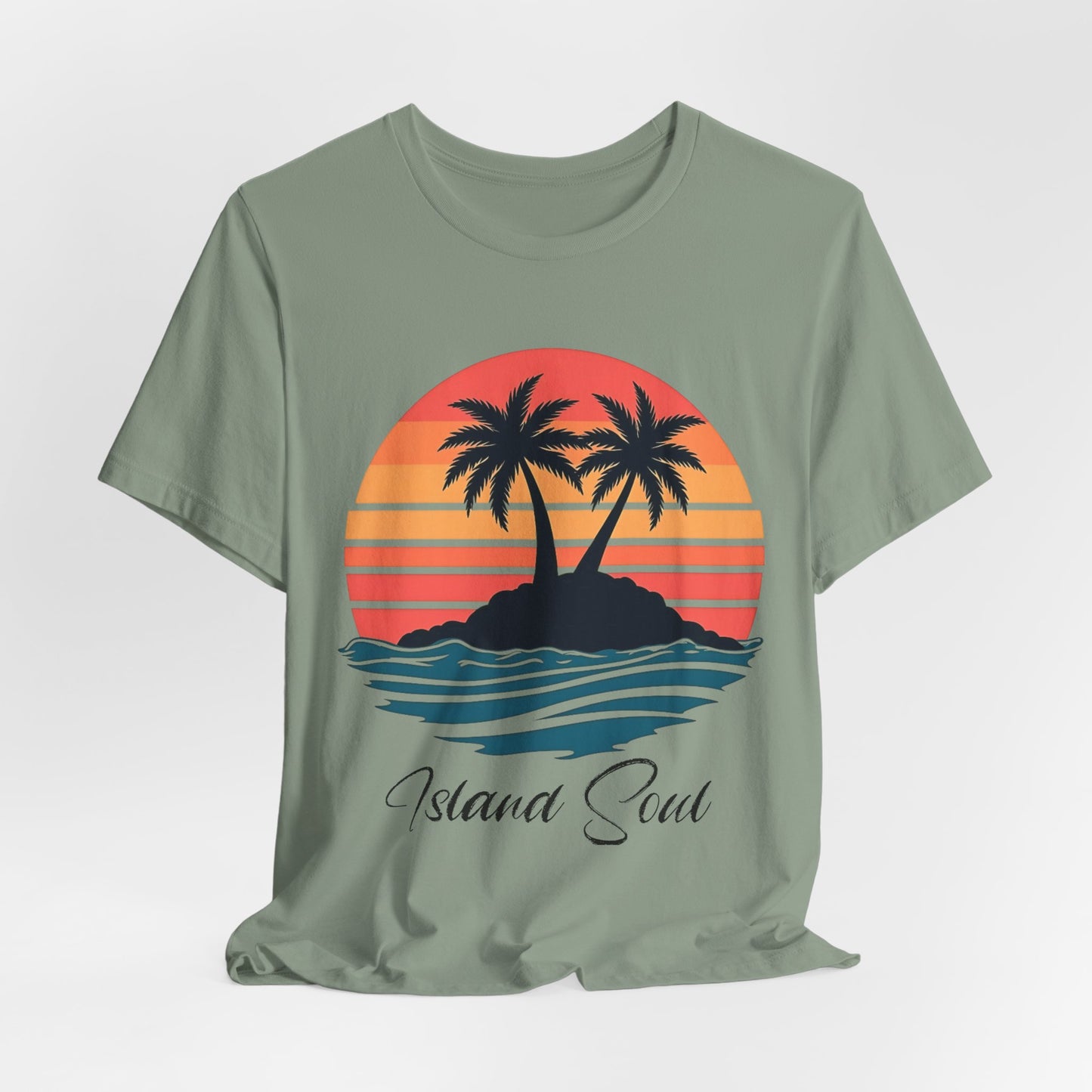 The Island Soul Unisex T-Shirt – Retro Sunset Tee with Palm Trees features a green design with two palms on an island, red-orange sunset, blue waves, and Island Soul below—ideal beachwear for laid-back island vibes.