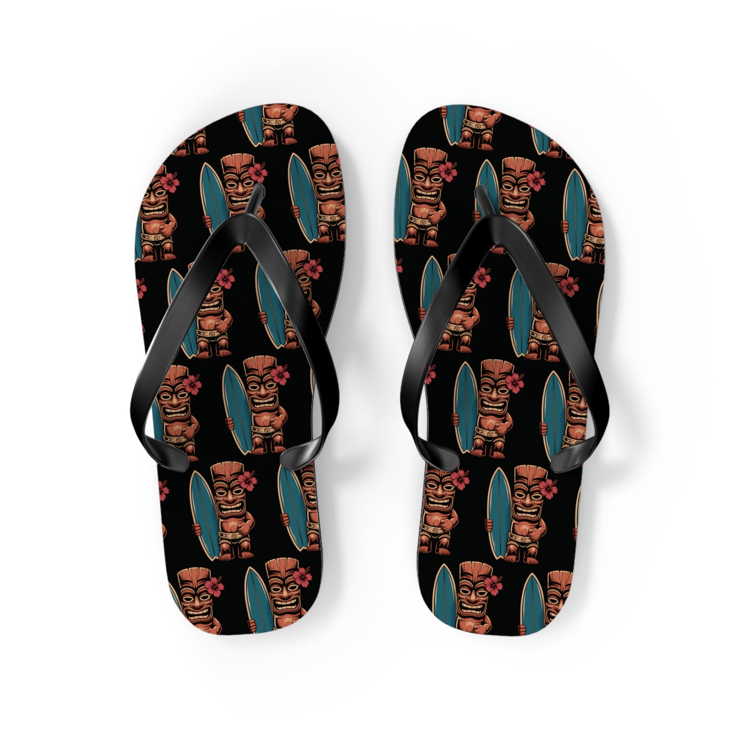The Tiki Surf Flip Flops - Fun Summer Beach Sandals feature black straps, soft polyester suede, and vibrant print of cartoon tiki figures with surfboards and red flowers on a dark background for a stylish, comfy look.