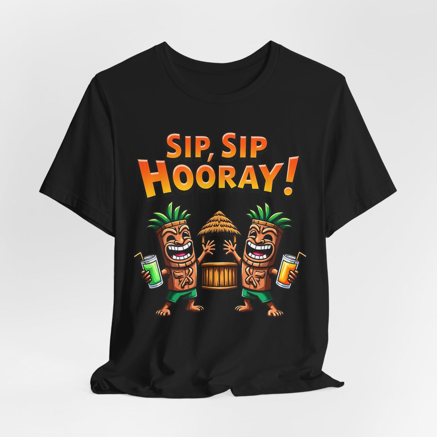 The Sip Sip Hooray Tropical Unisex Tiki T-Shirt is black and showcases two cartoon tiki characters with drinks by a tiki hut, topped with bold orange “Sip, Sip Hooray!” text.