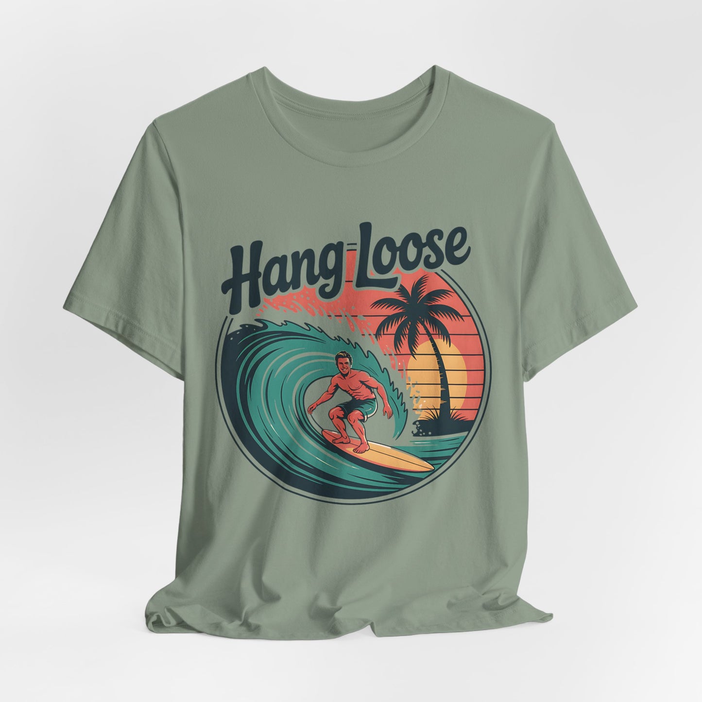 The Hang Loose Unisex Surf T-Shirt features a retro-style surfer, palm tree, and sunset graphic with “Hang Loose” above—perfect for embracing the beach lifestyle.