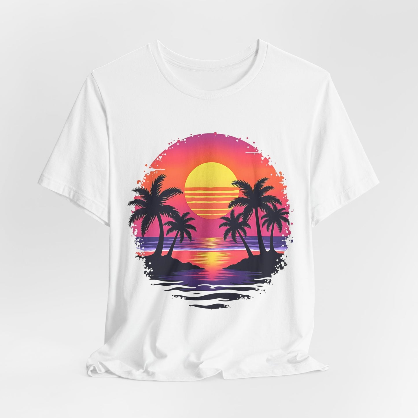 The Tropical Sunset Graphic T-Shirt is a unisex jersey short sleeve shirt featuring a vibrant sunset over the ocean with palm tree silhouettes and colorful reflections in a bold circular design—perfect for summer vibes.