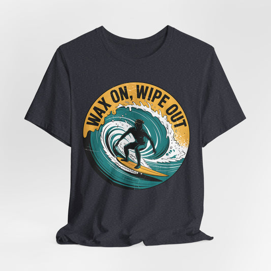 The Surfing Inspired Unisex Short Sleeve T-Shirt, Wax On, Wipe Out, features a bold surfer graphic and bright yellow text—ideal for surf enthusiasts and beach lovers alike.