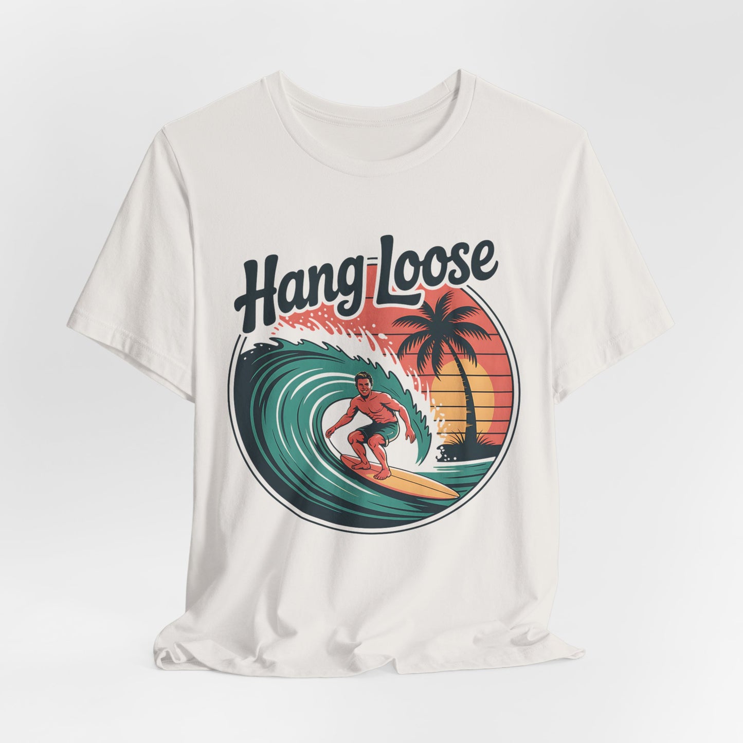 The Hang Loose Unisex Surf T-Shirt - Retro Beach Vibes Shirt boasts soft Airlume cotton and a sunset surfer design with palm trees and bold “Hang Loose” text—ideal for expressing your love for the beach lifestyle.