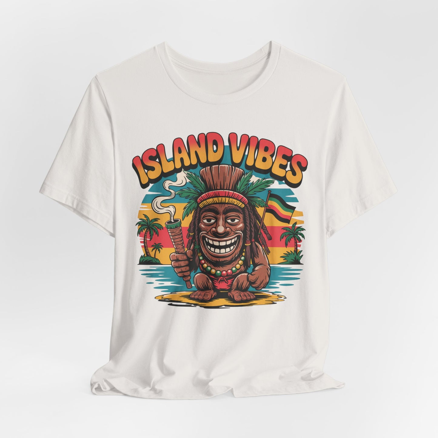 The Island Vibes Unisex Jersey Tiki T-Shirt features a vibrant tiki statue graphic with palm trees, water, and a sunset, plus bold ISLAND VIBES text—perfect for vacation or casual summer fun.