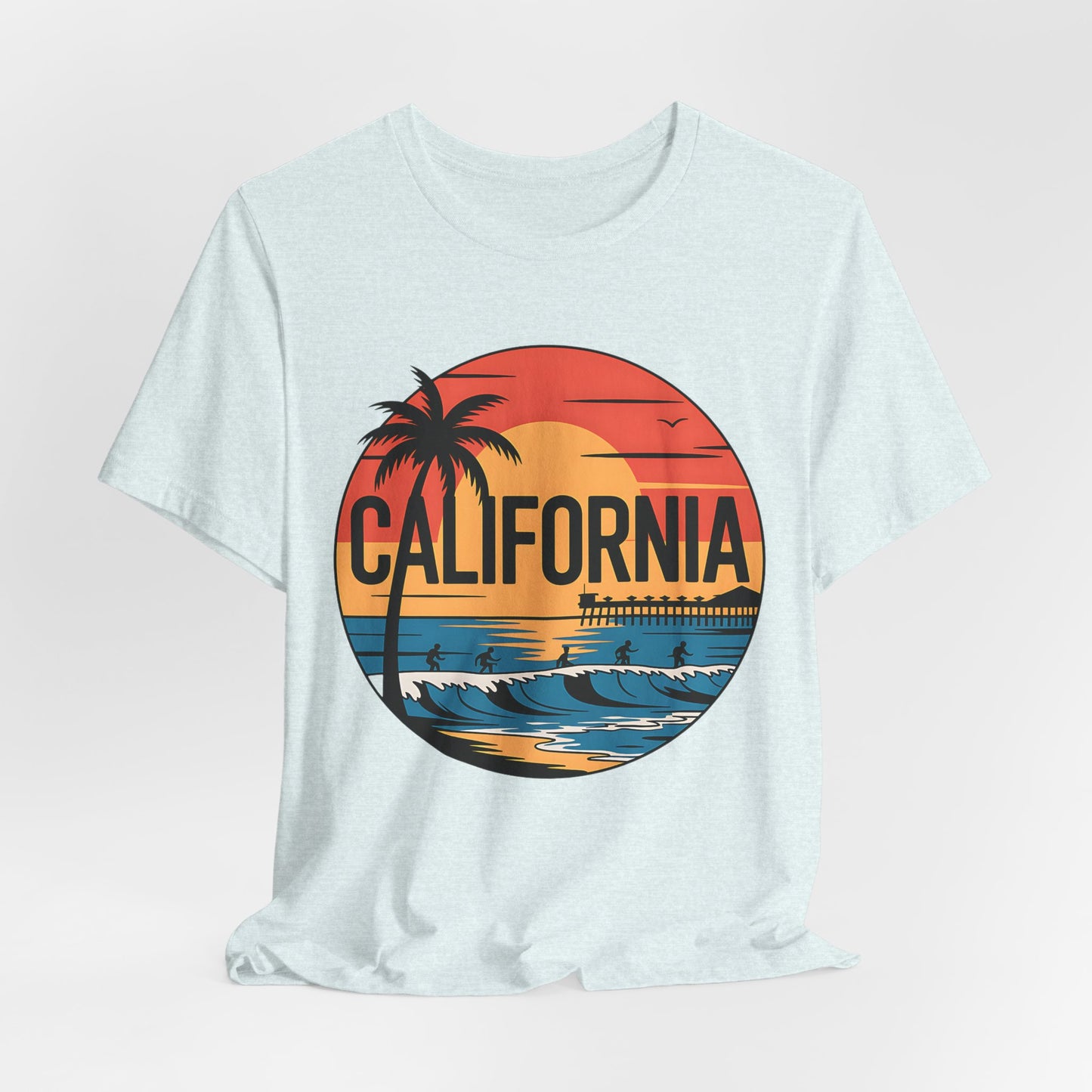 The California Sunset Graphic T-Shirt is a light-colored unisex tee with a round graphic of a sunset, palm tree, waves, pier, birds, and CALIFORNIA in bold—made from breathable cotton for summer comfort.