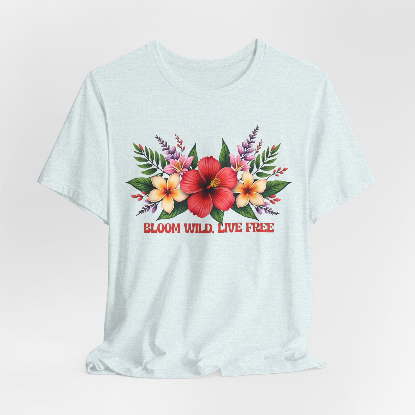 The Bloom Wild, Live Free Floral Tee - Unisex Jersey Short Sleeve T-Shirt features a light blue, breathable fabric, a bold floral print with red, yellow, and pink flowers and green leaves, plus BLOOM WILD, LIVE FREE in red lettering.