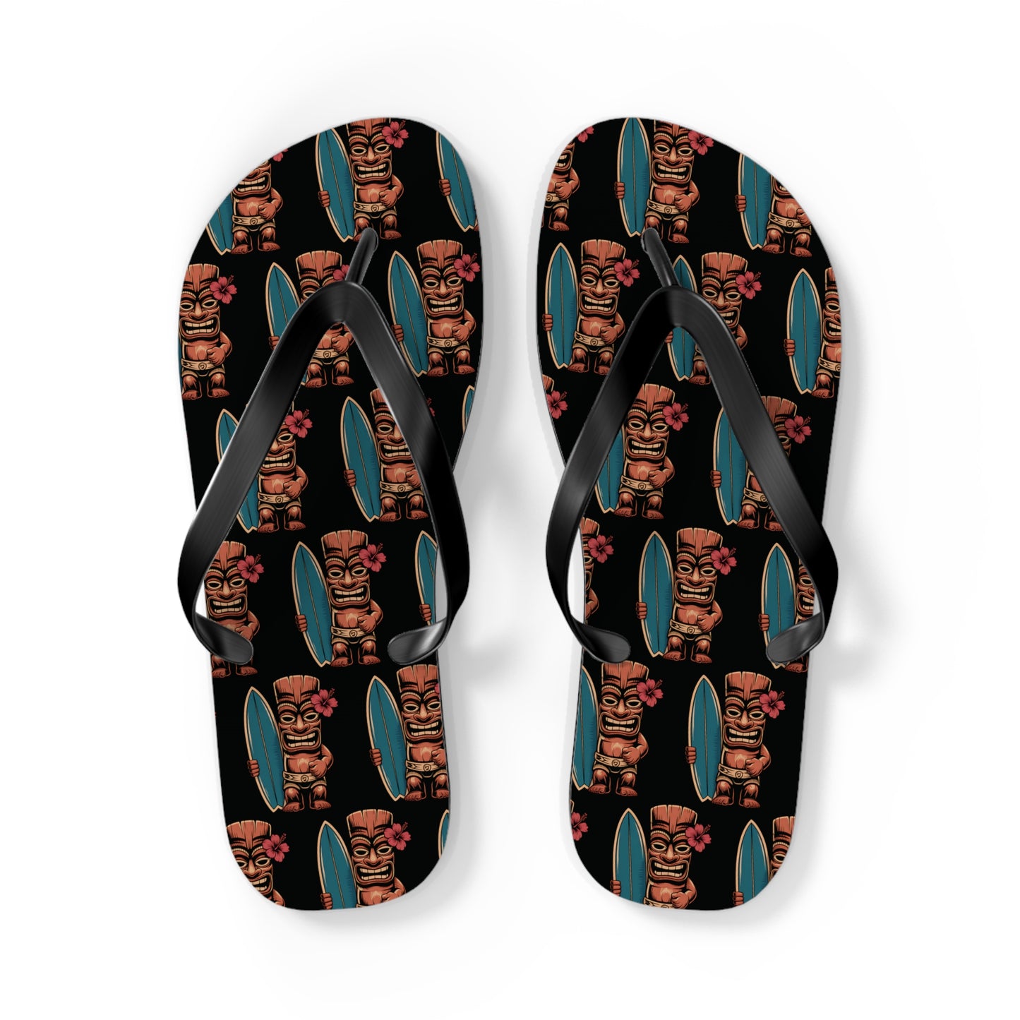 Tiki Surf Flip Flops - Fun Summer Beach Sandals with vibrant tiki statue, surfboard, and pink hibiscus prints on a black background. Black straps complete the stylish summer look.