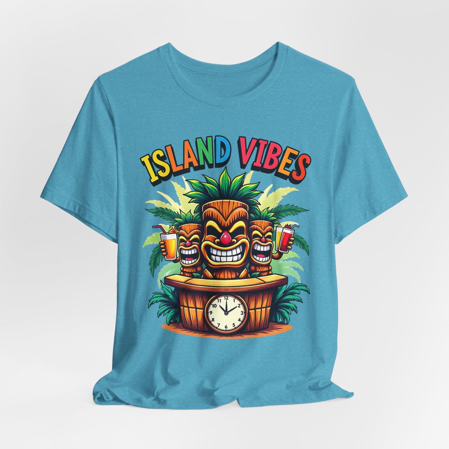 The Island Vibes Tiki T-Shirt – Unisex Relaxed Fit features three smiling tiki statues, palm trees, drinks, a clock, and rainbow “ISLAND VIBES” text. Perfect for tropical lovers seeking laid-back island style.