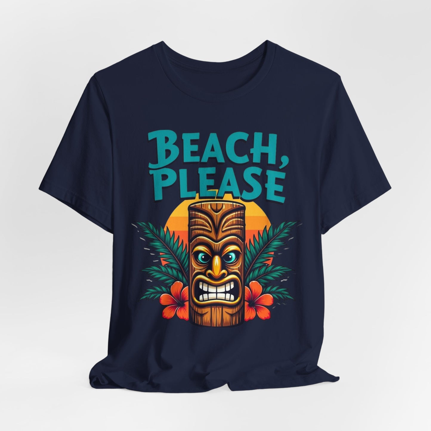 The Beach Please Unisex Short Sleeve Tiki T-Shirt – Summer Vibe Tee features a navy blue design with a vibrant tiki face, tropical leaves, red hibiscus flowers, a sunset backdrop, and BEACH PLEASE in bold teal letters—perfect for summer holidays.