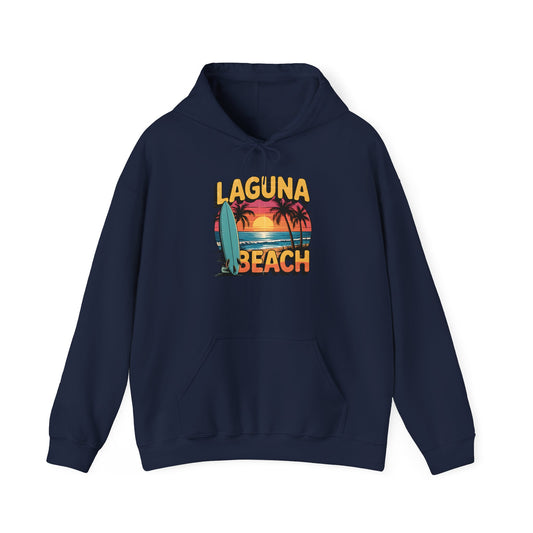 The Laguna Beach Sunset Hoodie for Beach Lovers is a navy blue hoodie with a retro sunset, palm trees, and surfboard graphic plus bold yellow and orange Laguna Beach lettering—an ideal casual pick for beach fans.