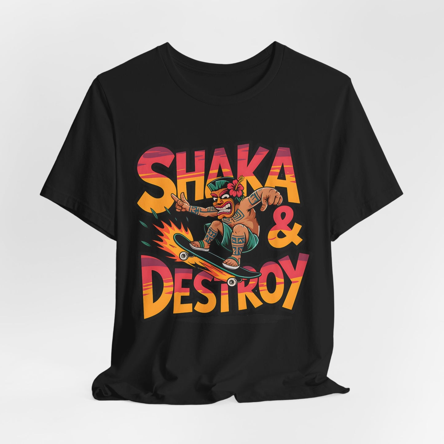 The Shaka & Destroy Graphic Tiki T-Shirt is a unisex jersey tee for skateboard enthusiasts, featuring a vibrant cartoon character skating on a flaming board with bold “SHAKA & DESTROY” text on breathable fabric.