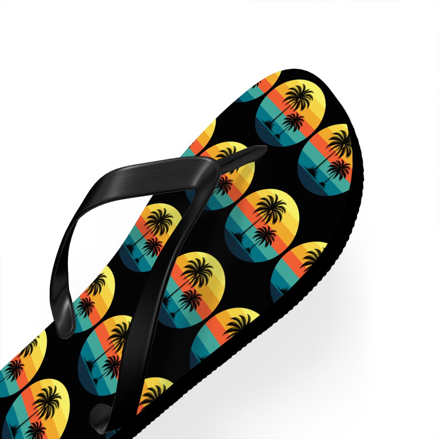The Tropical Sunset Flip Flops - Summer Vibes with Palm Trees feature black straps and vibrant yellow, orange, and blue sunset circles with palm tree silhouettes, perfect for beach lovers. Shown against a white background.