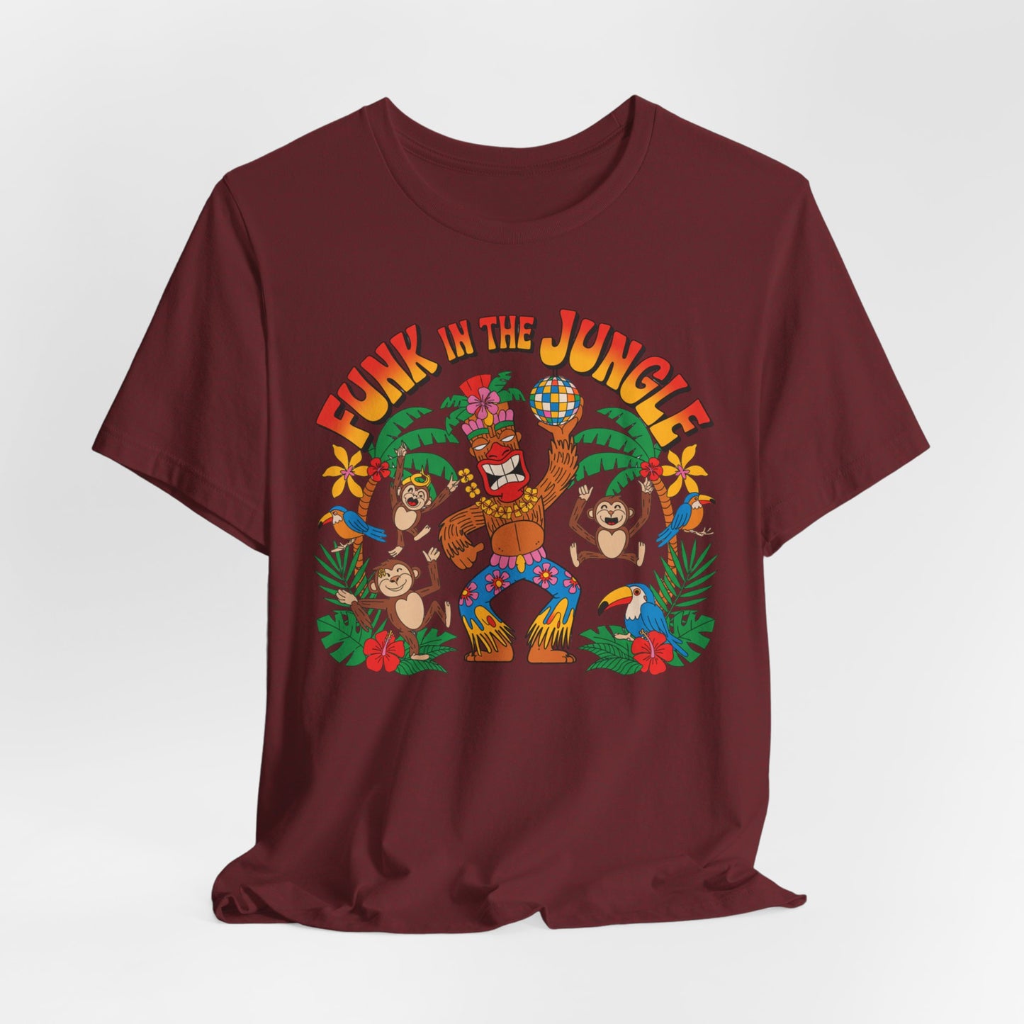 The Funky Jungle Tiki T-Shirt is a unisex short sleeve shirt with a vibrant monkey design and retro “Funk in the Jungle” lettering—perfect for anyone who loves playful jungle vibes.