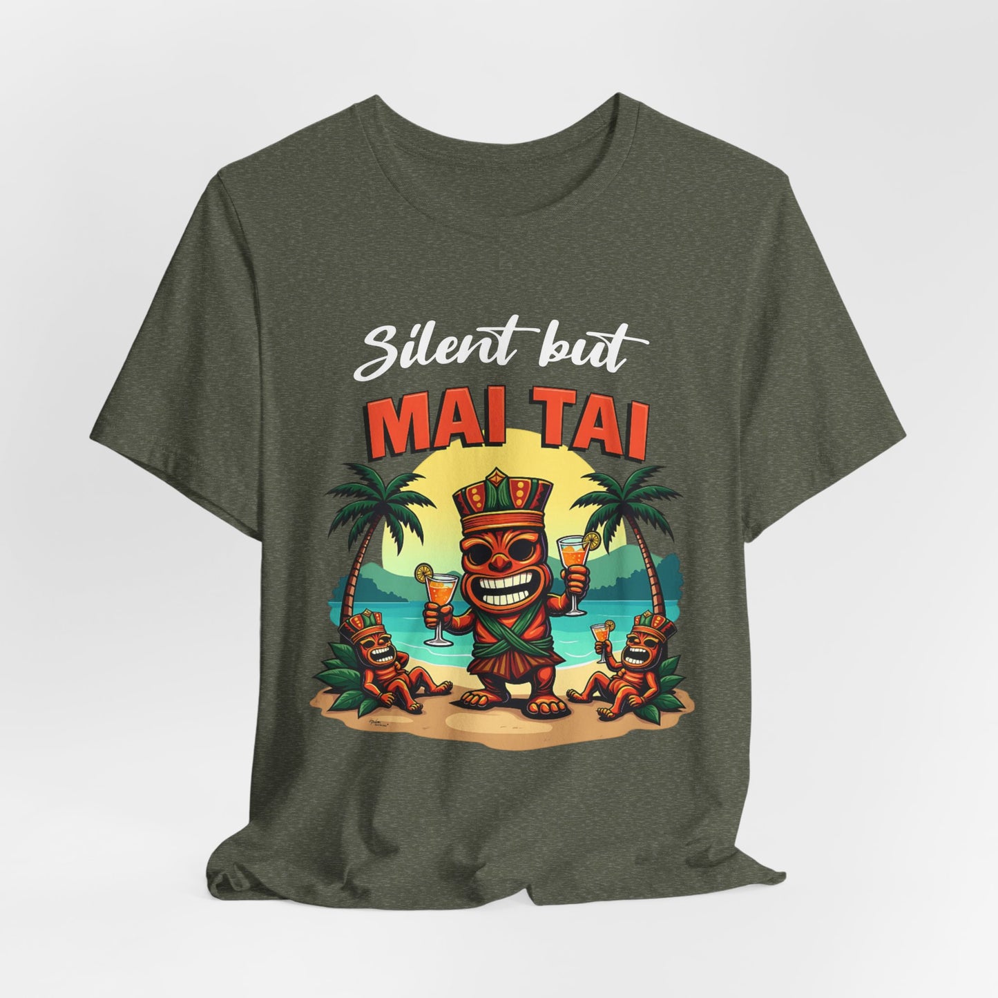 The Mai Tai Graphic Unisex Jersey Tiki T-Shirt features a cartoon tiki with drinks, two smaller tikis, palm trees, and a sunset beach. Silent but MAI TAI is printed in playful bold letters for tropical vibes.