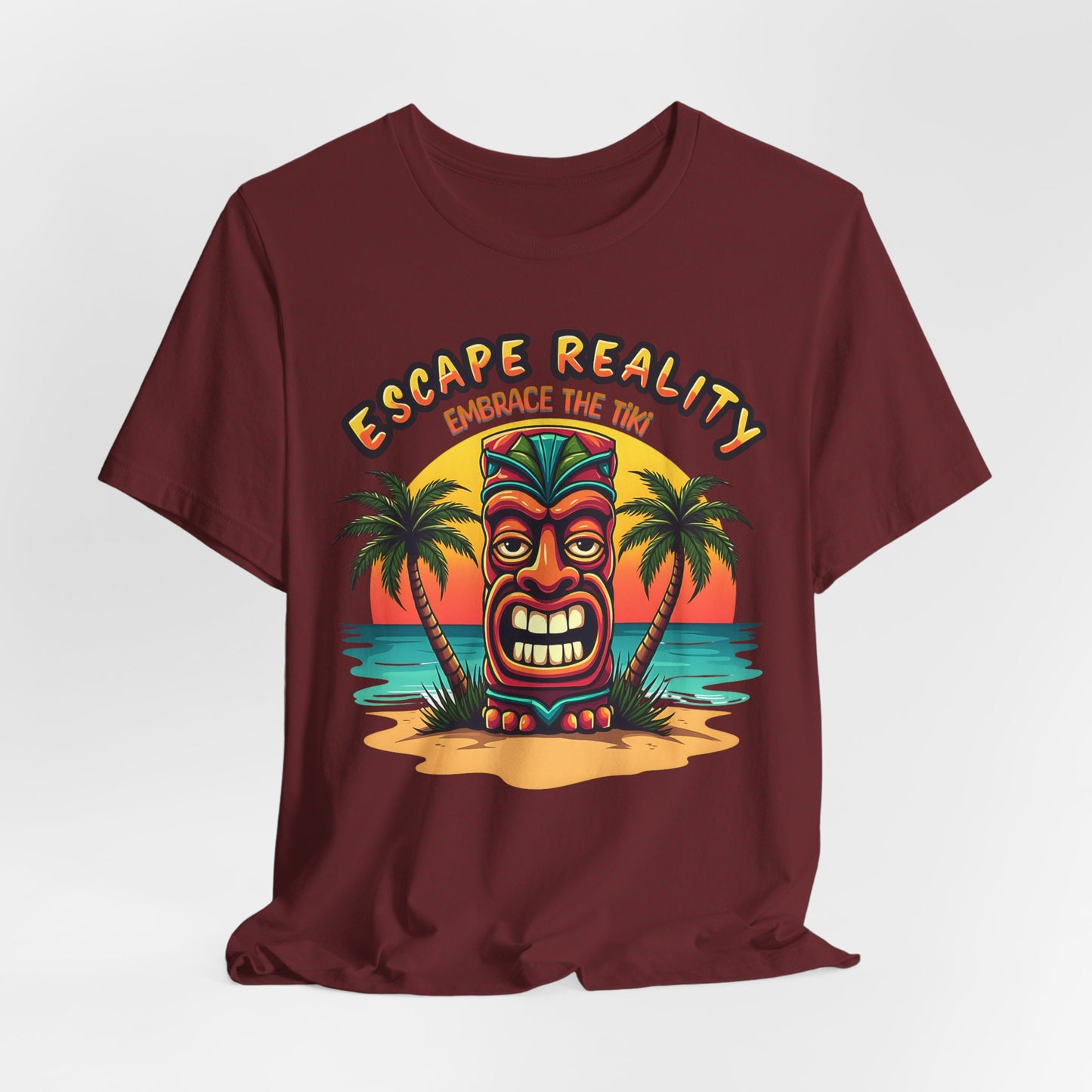 The Escape Reality Unisex Tiki T-Shirt features a vibrant tiki mask, palm trees, and sunset beach scene with ESCAPE REALITY above and EMBRACE THE TIKI below—perfect for summer and beach getaways. Embrace the tiki vibe!.
