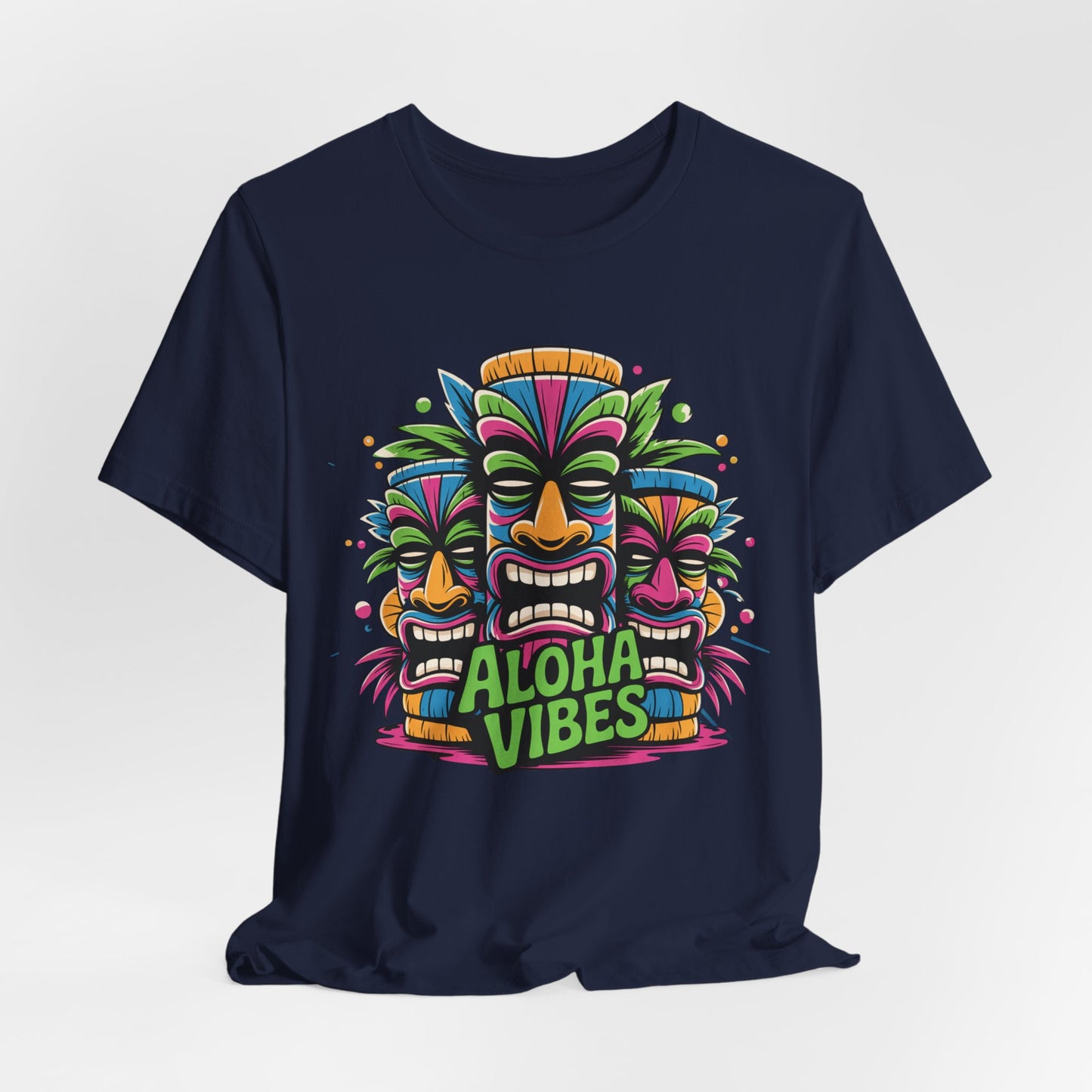 The Aloha Vibes Unisex Short Sleeve Tiki T-Shirt features three vibrant tiki masks and bold green Aloha Vibes text, making it the perfect tropical graphic tee for beach lovers and summer festivals.