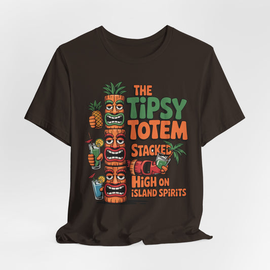 The Tiki Cocktail Tee - The Tipsy Totem Graphic Shirt features three vibrant tiki totems, tropical drinks, a pineapple, and the phrase Stacked High on Island Spirits—ideal for summer parties and adding a fun tropical vibe.