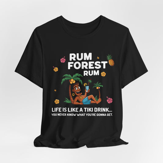 Black unisex T-shirt featuring a relaxed man holding a drink, palm trees, pineapples & flowers. Text: Life Is Like A Tiki Drink. Perfect for fans of tropical vibes and beach vacation style.