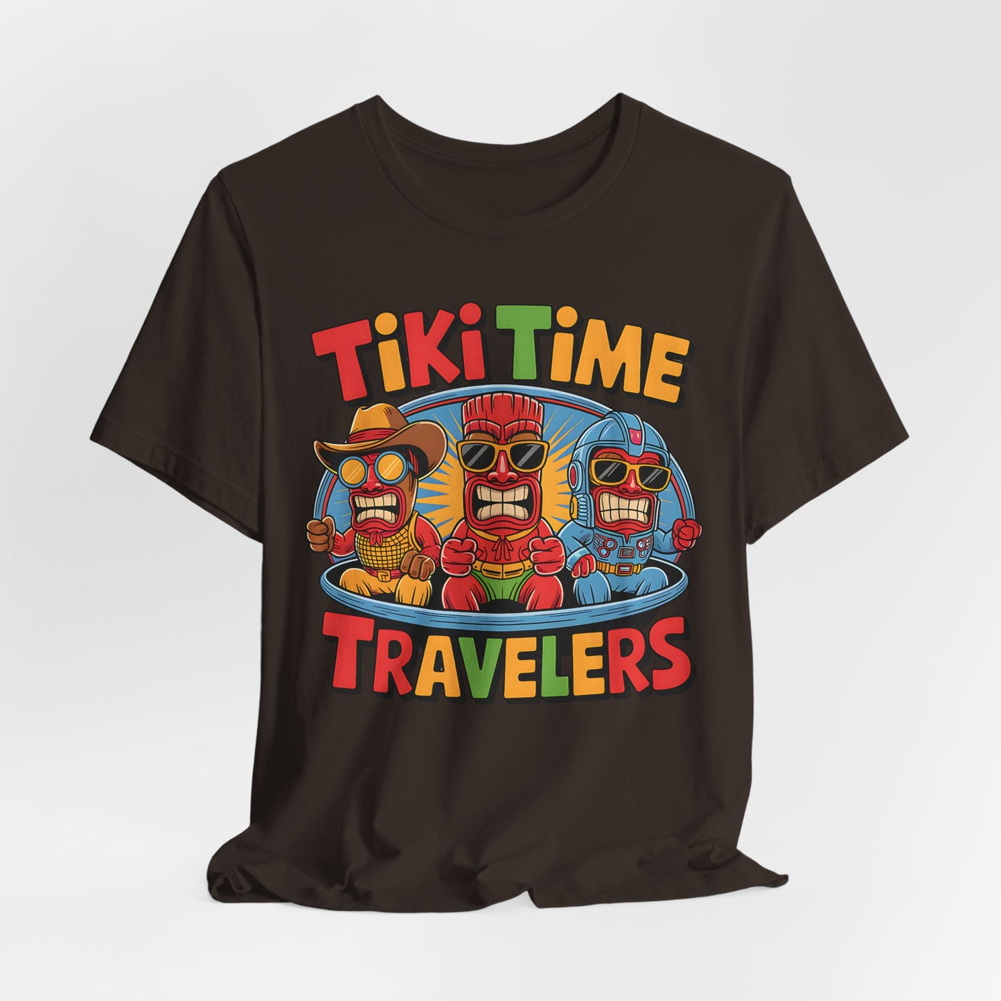 The Tiki Time Travelers Unisex Tiki T-Shirt features three cartoon tiki figures in sunglasses and colorful outfits in a blue time machine, with bold Tiki Time Travelers text in red, yellow, green, and orange. Fun & vibrant—perfect for summer!.