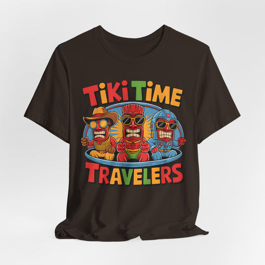 The Tiki Time Travelers Unisex Tiki T-Shirt features three cartoon tiki figures in sunglasses and colorful outfits in a blue time machine, with bold Tiki Time Travelers text in red, yellow, green, and orange. Fun & vibrant—perfect for summer!.