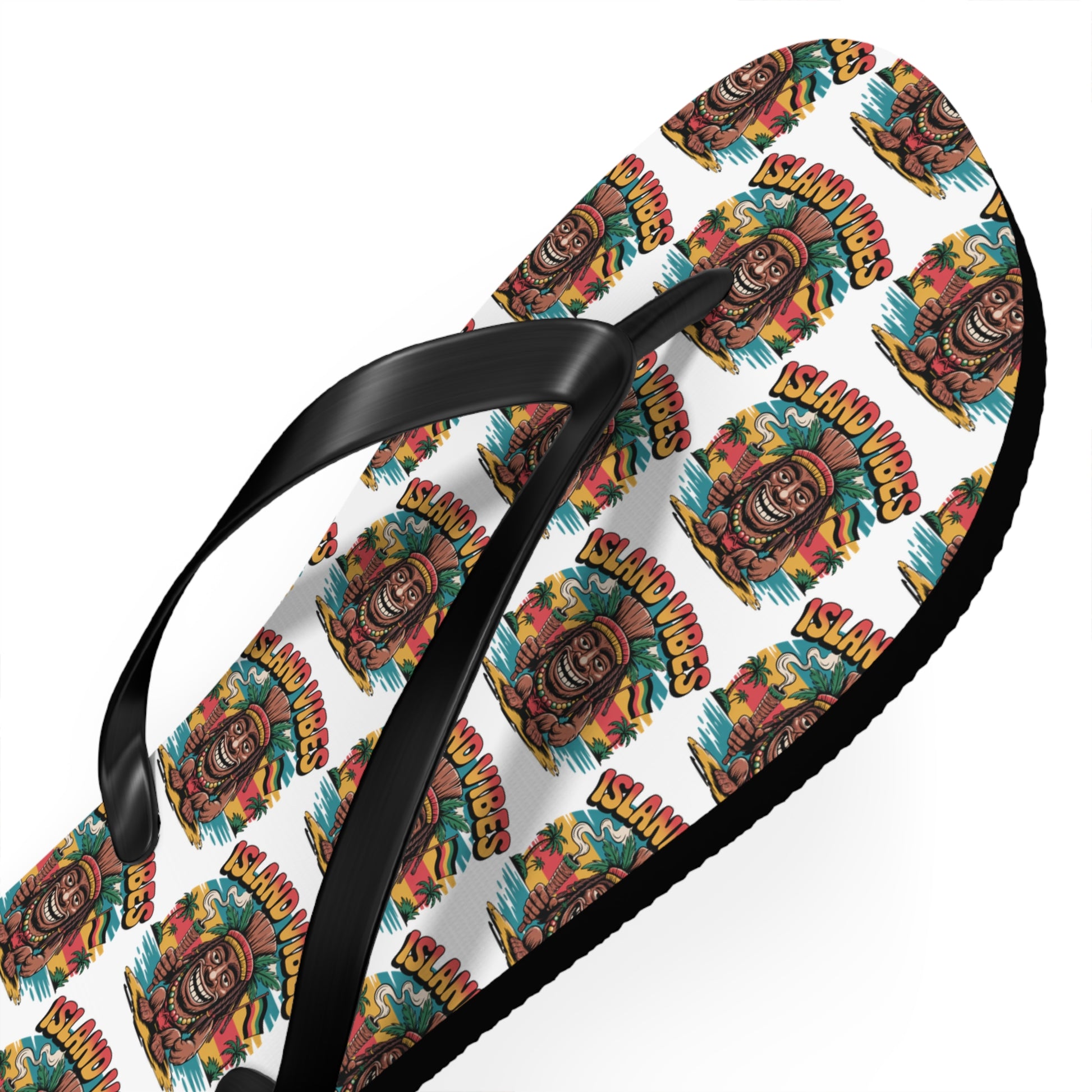 Ideal for summer fun, the Island Vibes Tiki Flip Flops feature black straps and a vibrant tiki mask and tropical plant pattern with “ISLAND VIBES” text on a white background—perfect for beach lovers and vacations.