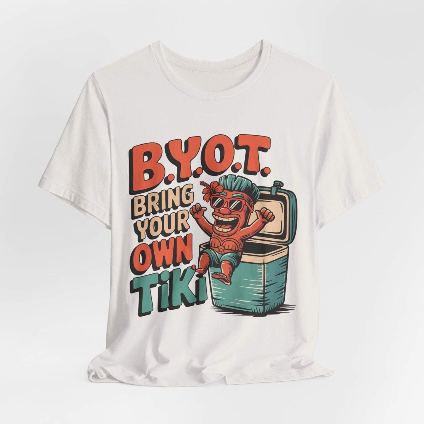 The Bring Your Own Tiki Short Sleeve Tiki T-Shirt—fun unisex summer party wear—features soft Airlume cotton, a cheerful tiki cartoon in an ice chest, and bold “B.Y.O.T. Bring Your Own Tiki” text for vibrant celebrations!.