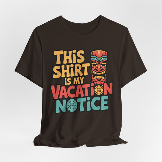 The Tiki T-Shirt - This Shirt is My Vacation Notice Funny Travel T-Shirt features colorful text and a tiki mask on a black unisex jersey, offering a playful, vacation-themed design.