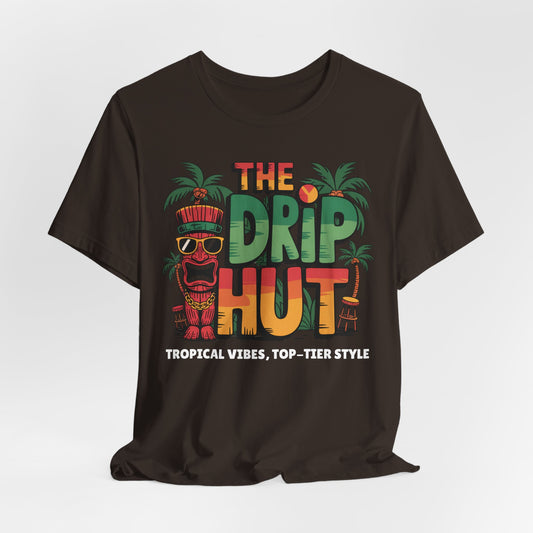 The Tropical Vibes Unisex Tiki T-Shirt - The Drip Hut is a black tee with a vibrant tiki and palm trees design. Features THE DRIP HUT text and Tropical vibes, top-tier style—your must-have island vibe shirt.