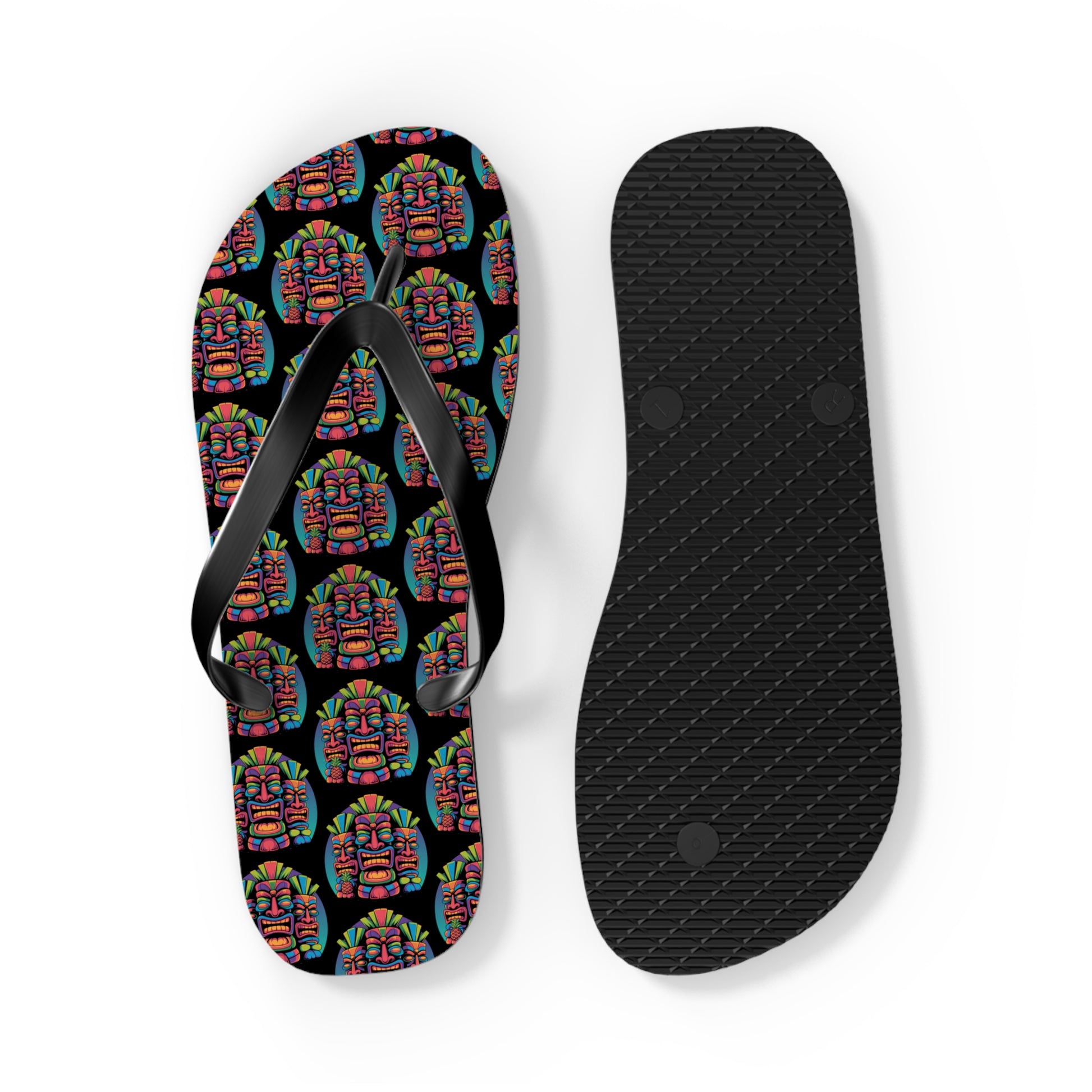 Tropical Pineapple Flip Flops - Fun Summer Footwear: One flip-flop has a black sole, while the other features a vibrant pineapple pattern on black with black straps—ideal summer accessories to brighten up your beachwear.