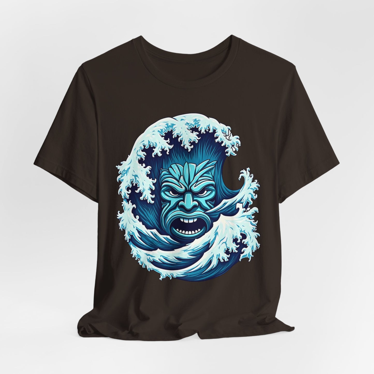 Ideal for beach lovers, the Ocean Wave Tiki- Adventure Vibes Unisex Jersey T-Shirt is made from soft Airlume cotton and showcases a bold blue ocean wave with a fierce tiki face at its center.