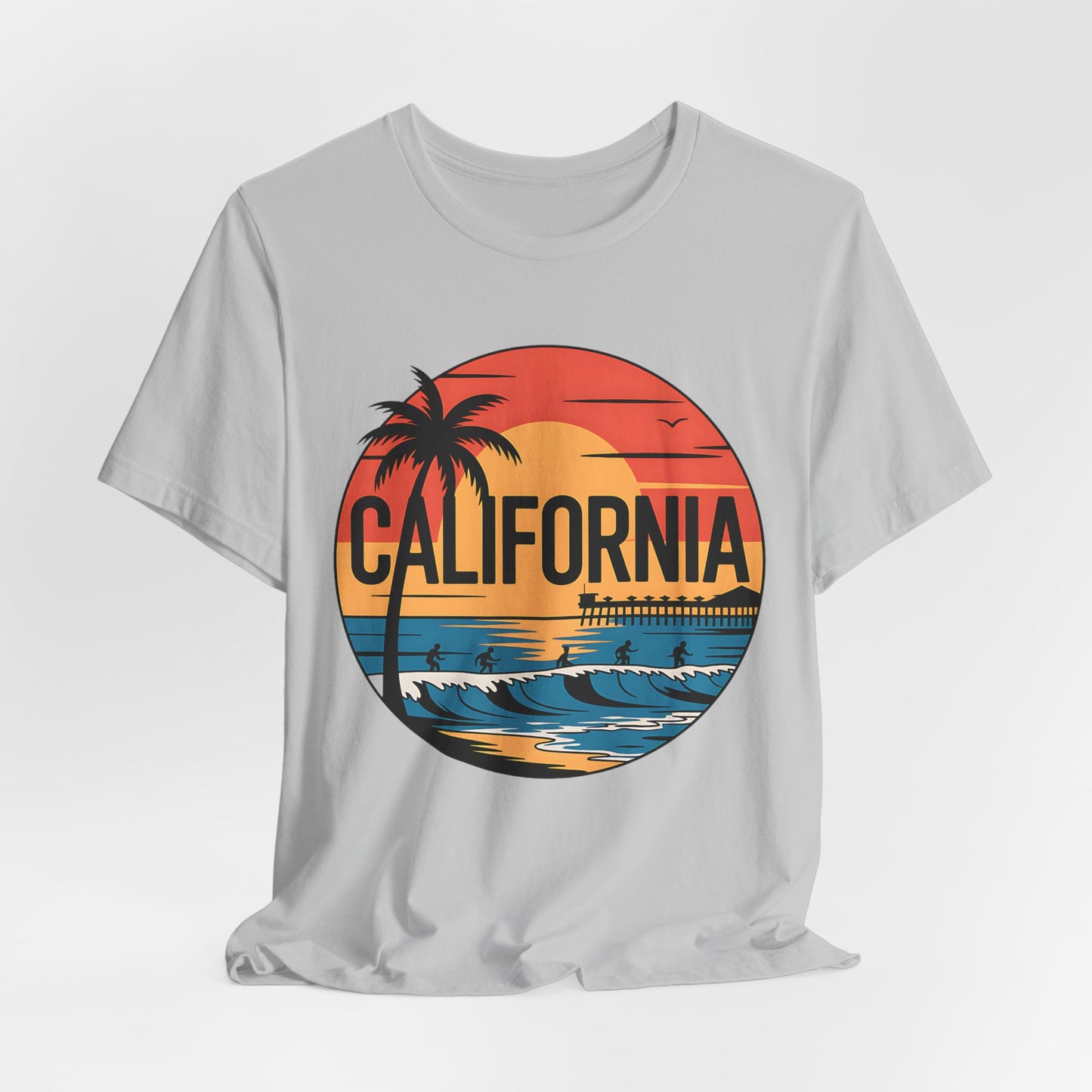 The California Sunset Graphic T-Shirt is a white unisex jersey tee with a sunset, palm tree, ocean waves, and birds graphic. California stands out on this breathable cotton staple—perfect for summer style.